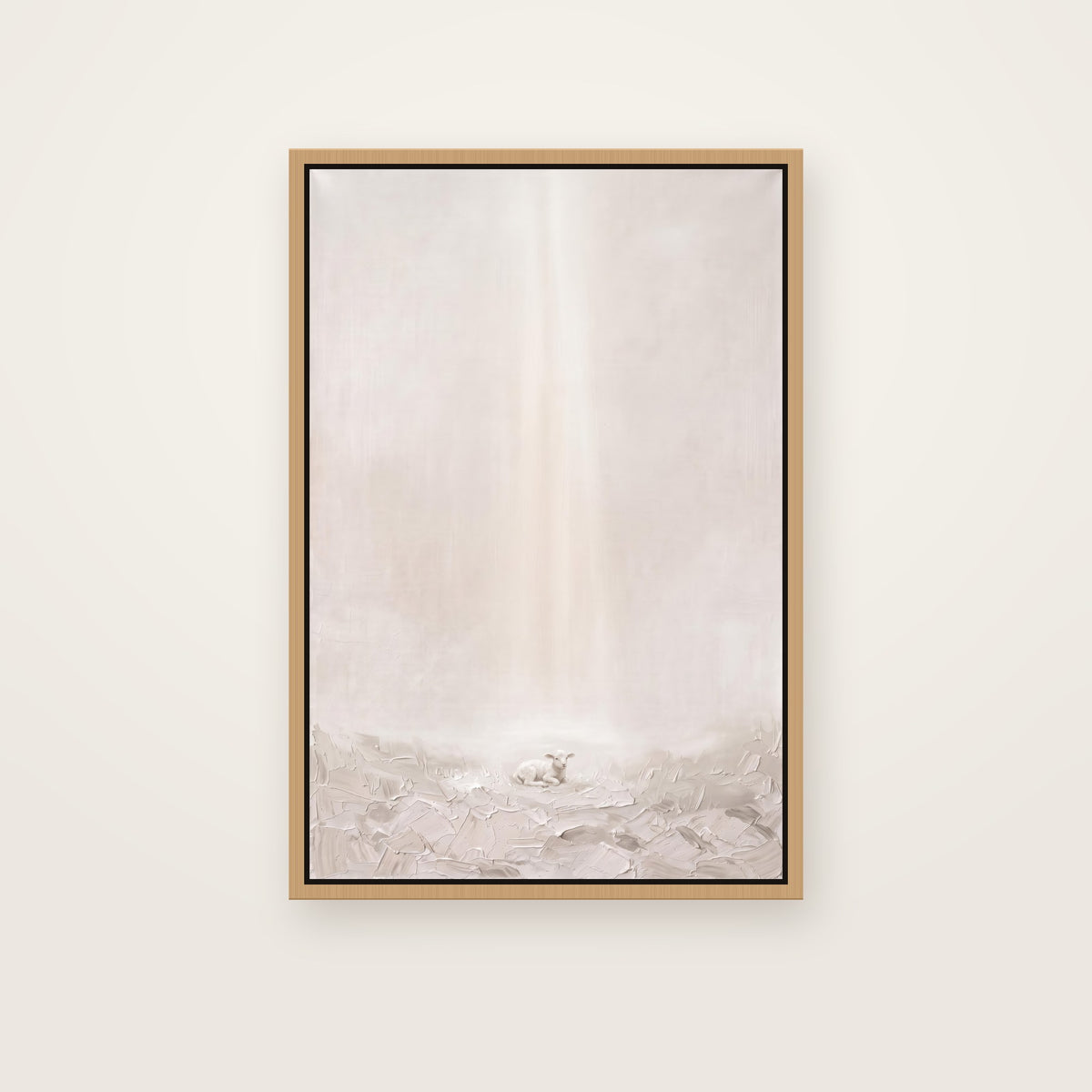 Behold the Lamb Christian wall art framed canvas print in a natural floating frame, showing a small lamb resting in soft grass under a gentle beam of light
